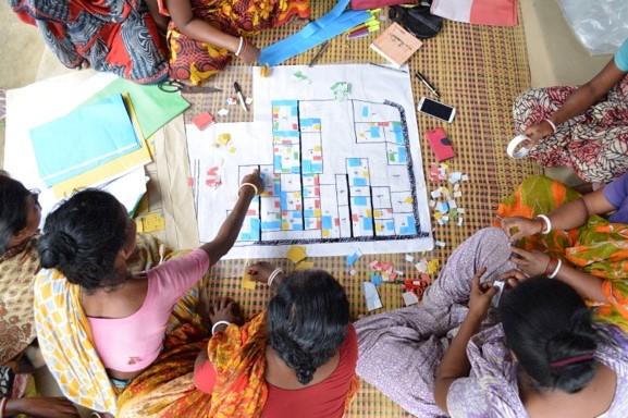 On the base map the community located houses, kitchens, animal shade, water points, toilets with color papers. While making the map, there were confusions, but they could do the map very detailed even with the orientation of houses. They learned to manage how to work together, even with small tasks like paper cutting, taping, drawing etc. 